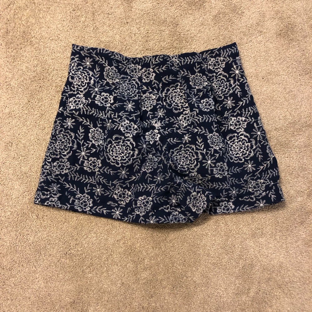 White embroidered high waisted shorts.